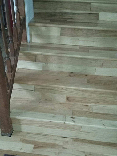 Hardwood floor installed on stairs